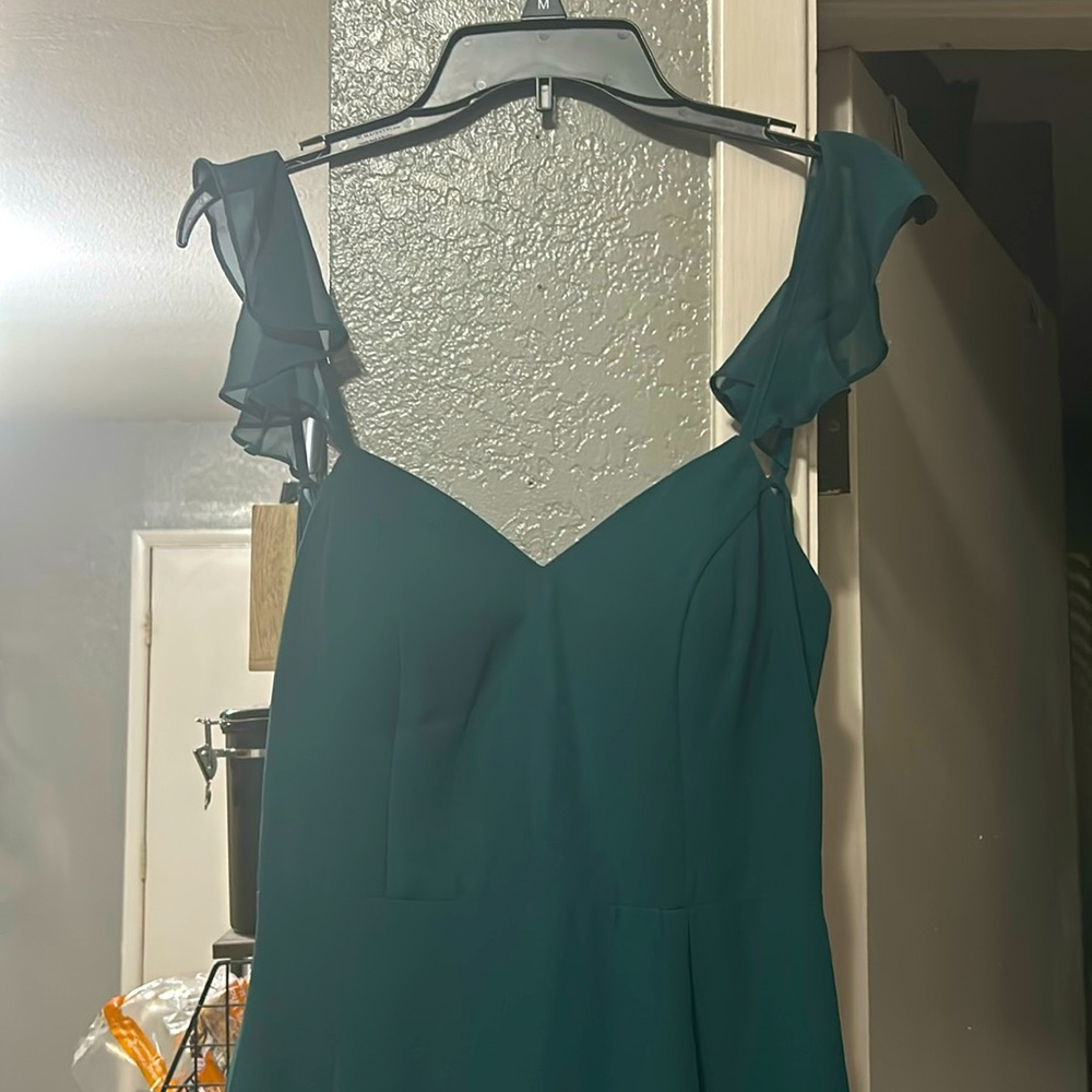 Emerald green formal azazie dress.